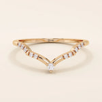 Slim chevron-shaped curve ring in 14k solid gold, accented with pavé moissanites. A delicate nesting band with modern lines and sparkle.