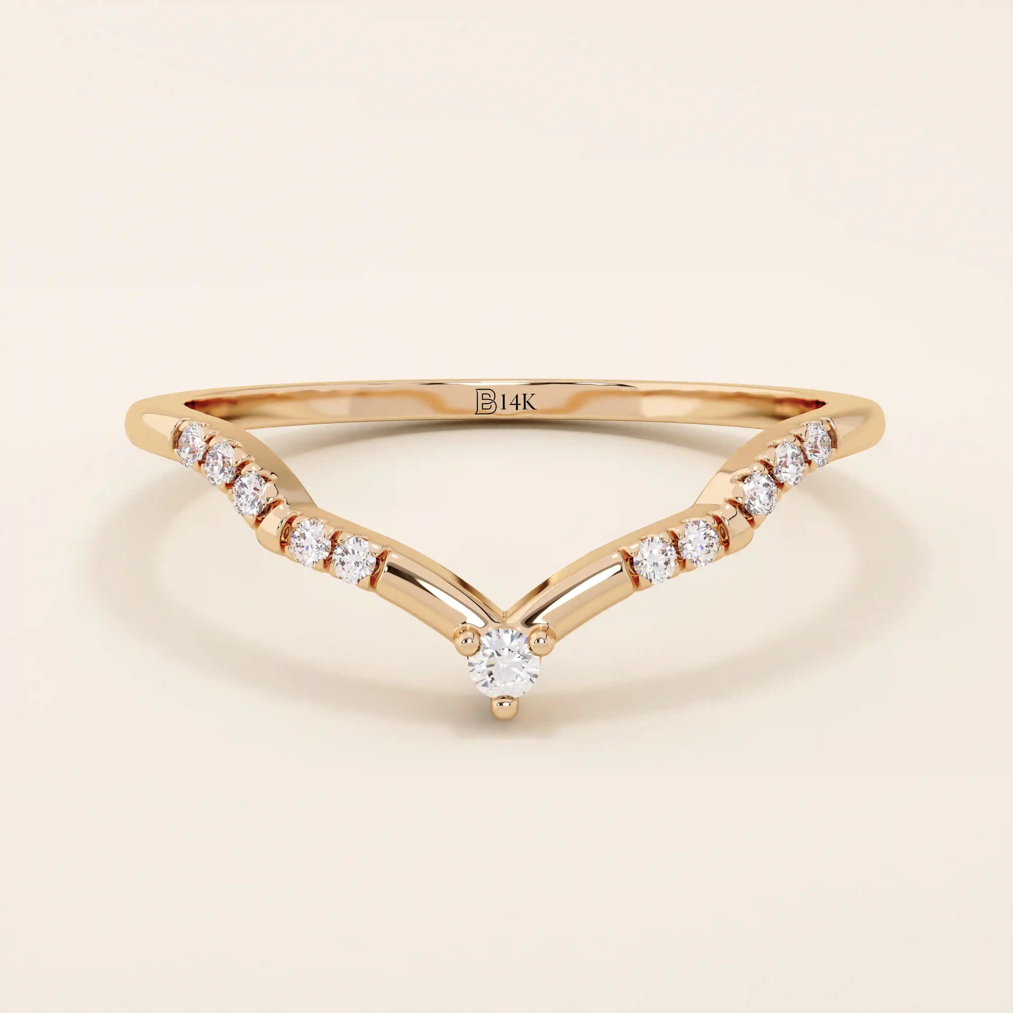Slim chevron-shaped curve ring in 14k solid gold, accented with pavé moissanites. A delicate nesting band with modern lines and sparkle.