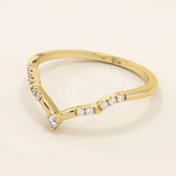 Slim chevron-shaped curve ring in 14k solid gold, accented with pavé moissanites. A delicate nesting band with modern lines and sparkle.