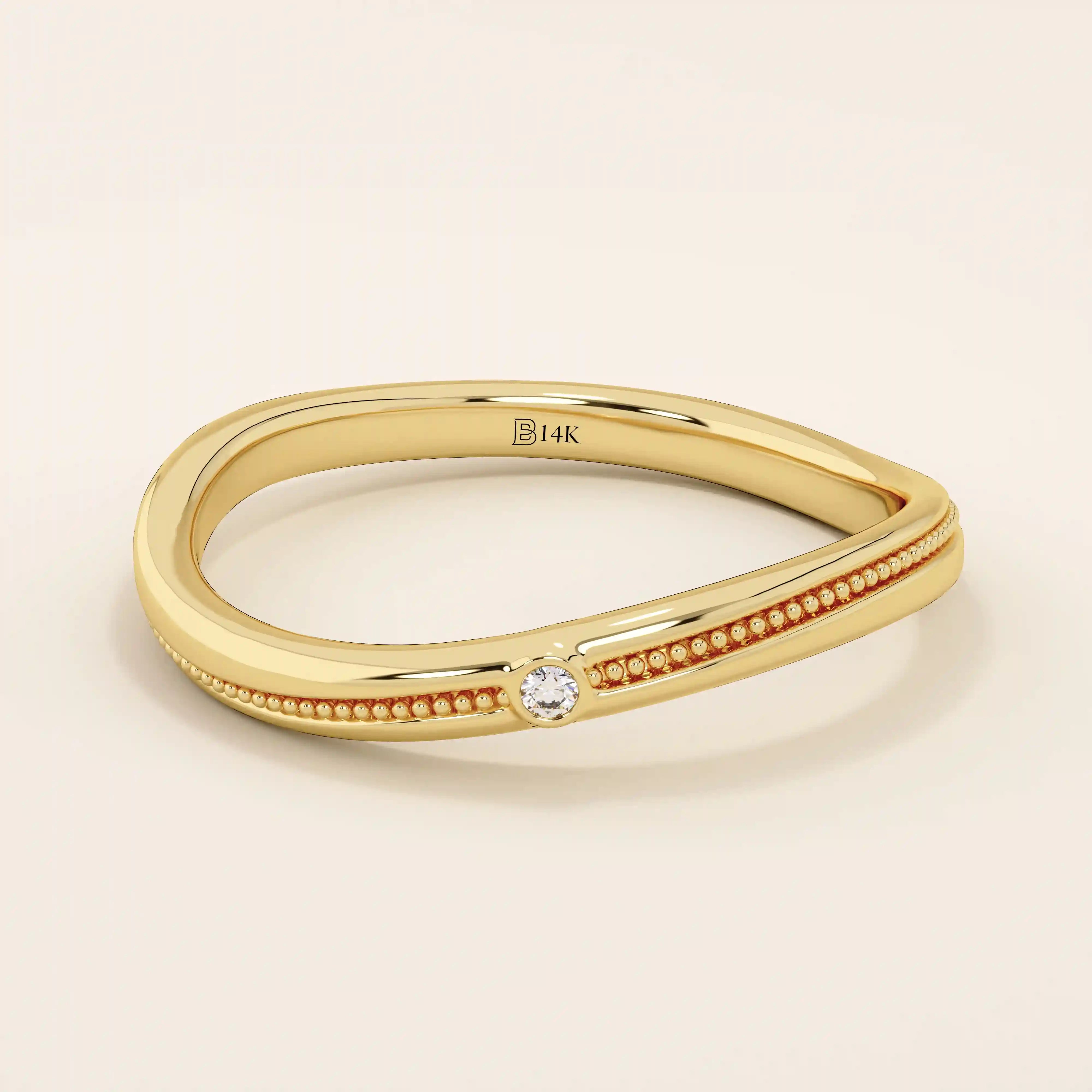 Slim curved ring in 14k solid gold with a beaded band and a single tiny moissanite. A delicate and stackable everyday piece.
