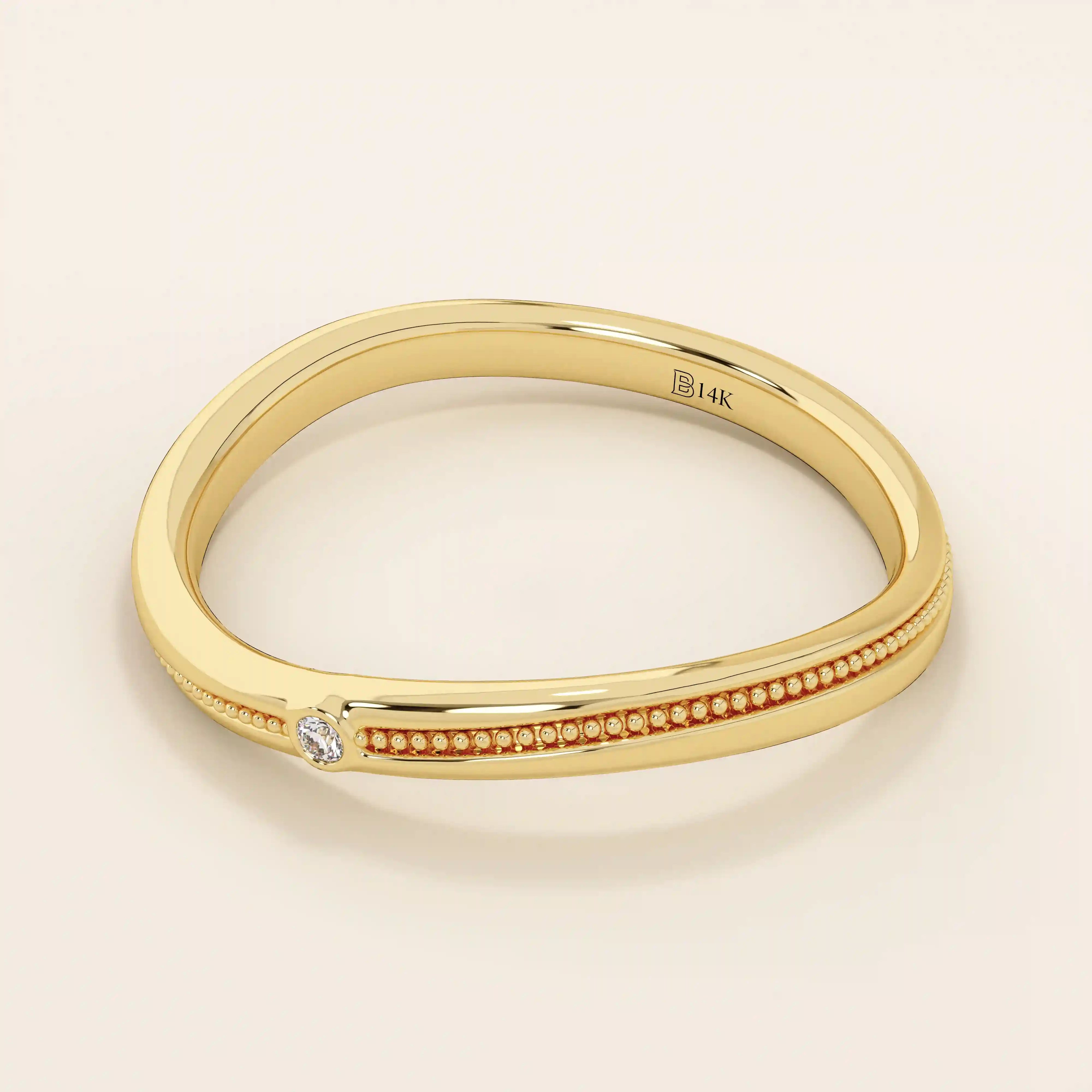 Slim curved ring in 14k solid gold with a beaded band and a single tiny moissanite. A delicate and stackable everyday piece.