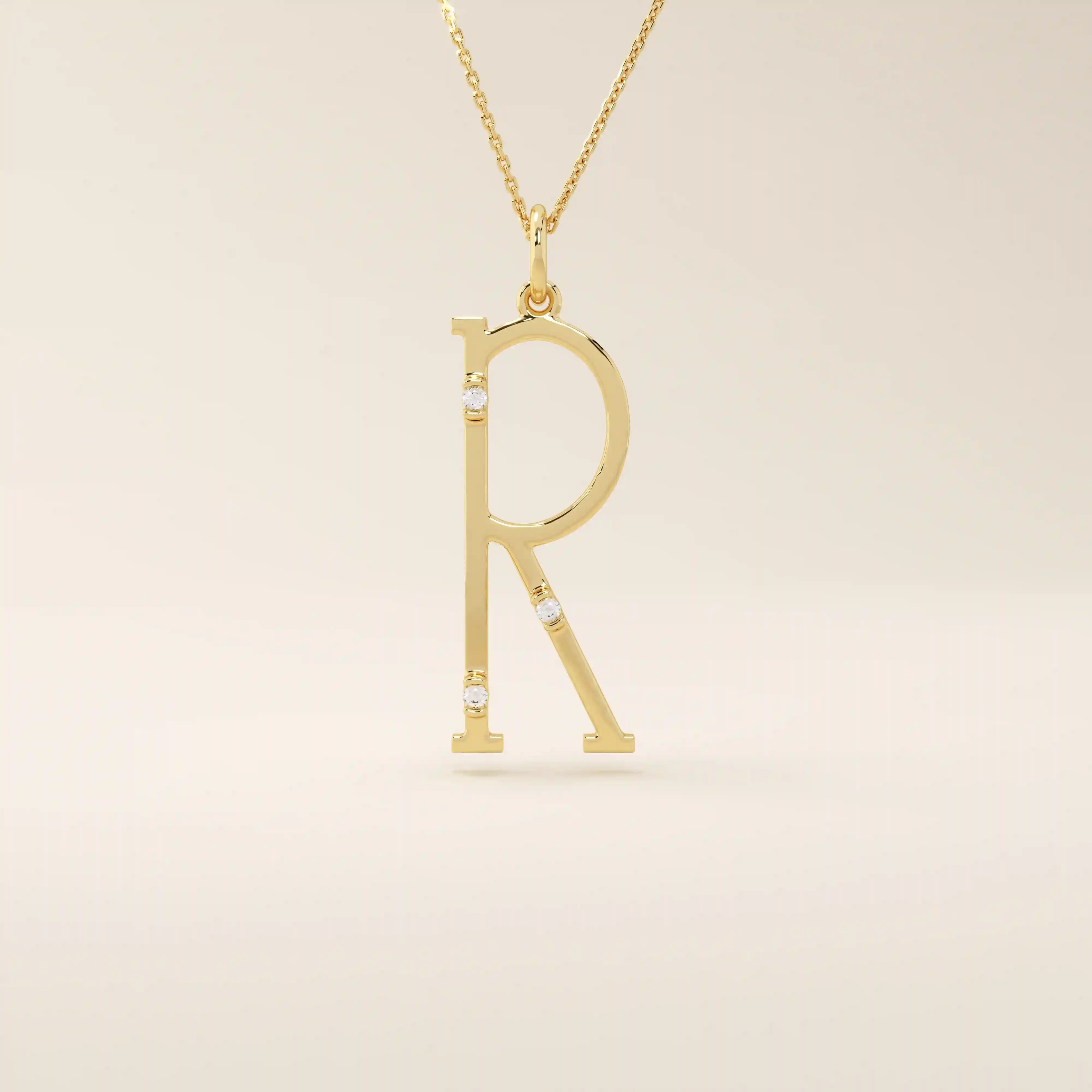 Slim initial letter necklace in 14k solid gold, accented with tiny moissanites for subtle sparkle. A sleek and personal everyday accessory.
