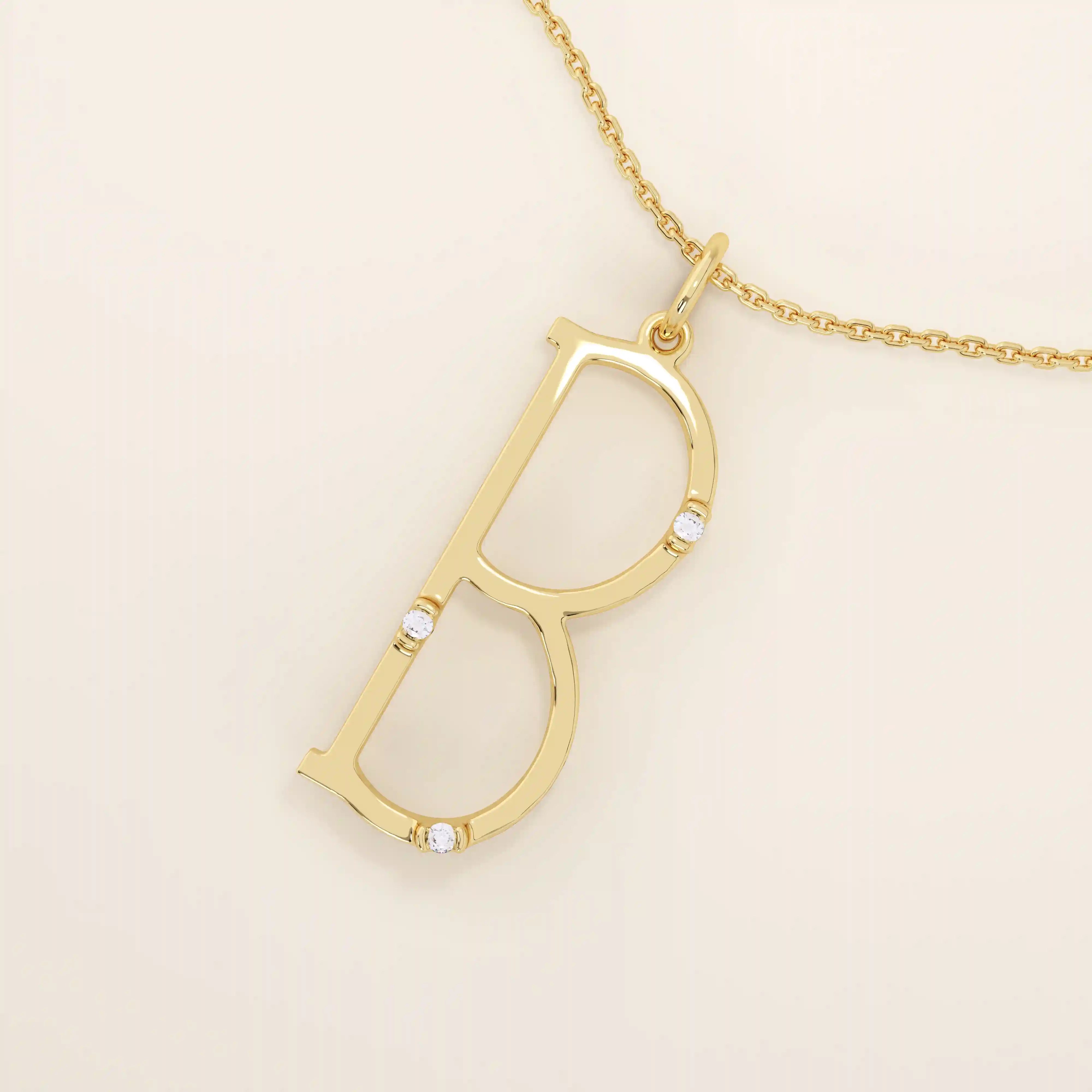 Slim initial letter necklace in 14k solid gold, accented with tiny moissanites for subtle sparkle. A sleek and personal everyday accessory.