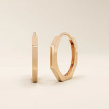 Small minimal hoop earrings in 14k rose gold, featuring a clean and contemporary design.
