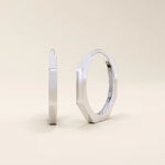 Small minimal hoop earrings in 14k white gold, crafted in a modern geometric shape.
