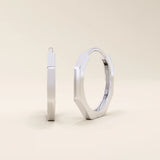 Small minimal hoop earrings in 14k white gold, crafted in a modern geometric shape.
