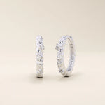 Twist rope hoop earrings in 14k white gold, set with shimmering moissanite for a refined touch.
