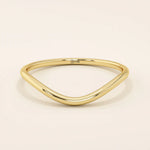 Ultra slim curved nesting ring in 14k solid gold, designed for a seamless fit around engagement rings. Minimalist and lightweight for everyday wear.