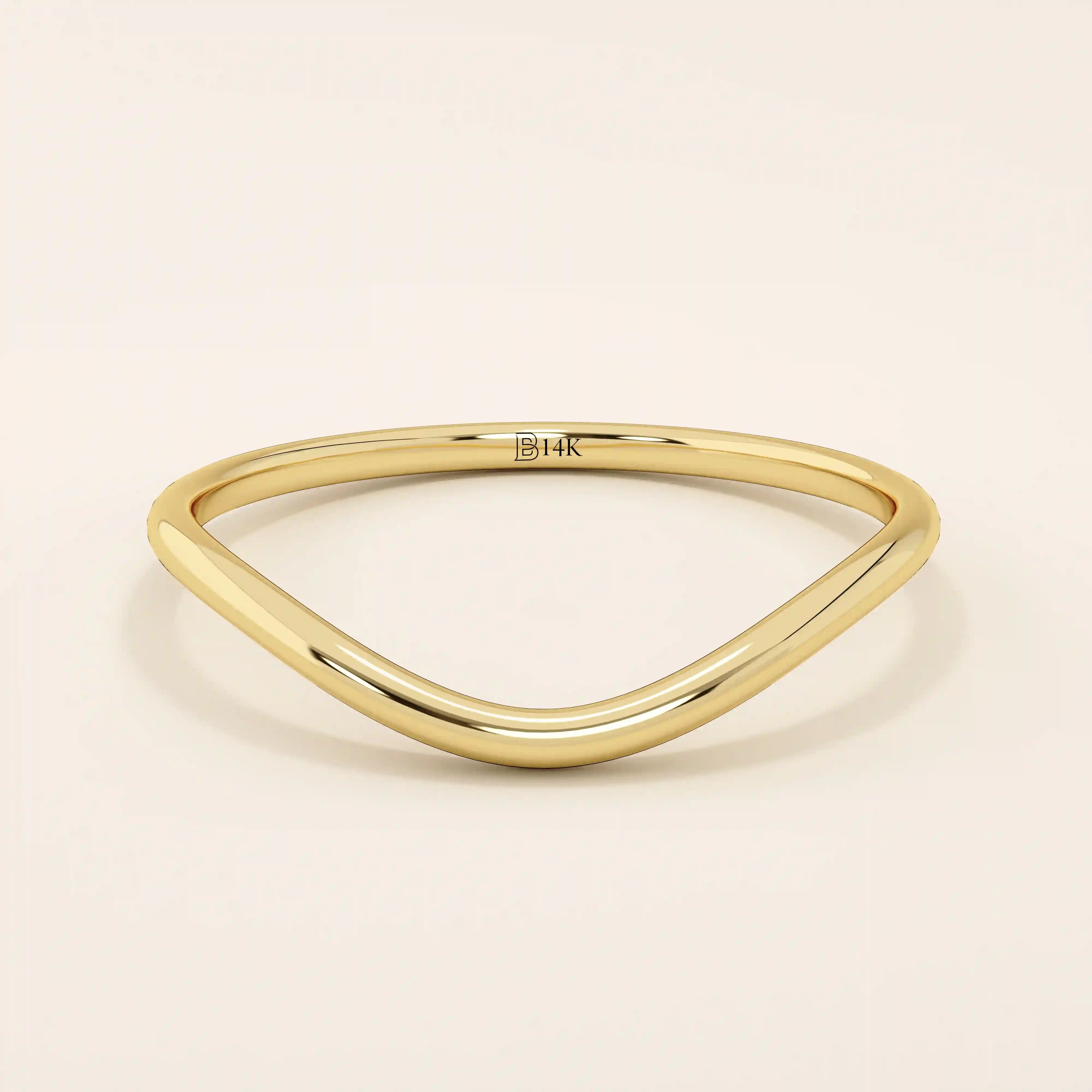 Ultra slim curved nesting ring in 14k solid gold, designed for a seamless fit around engagement rings. Minimalist and lightweight for everyday wear.