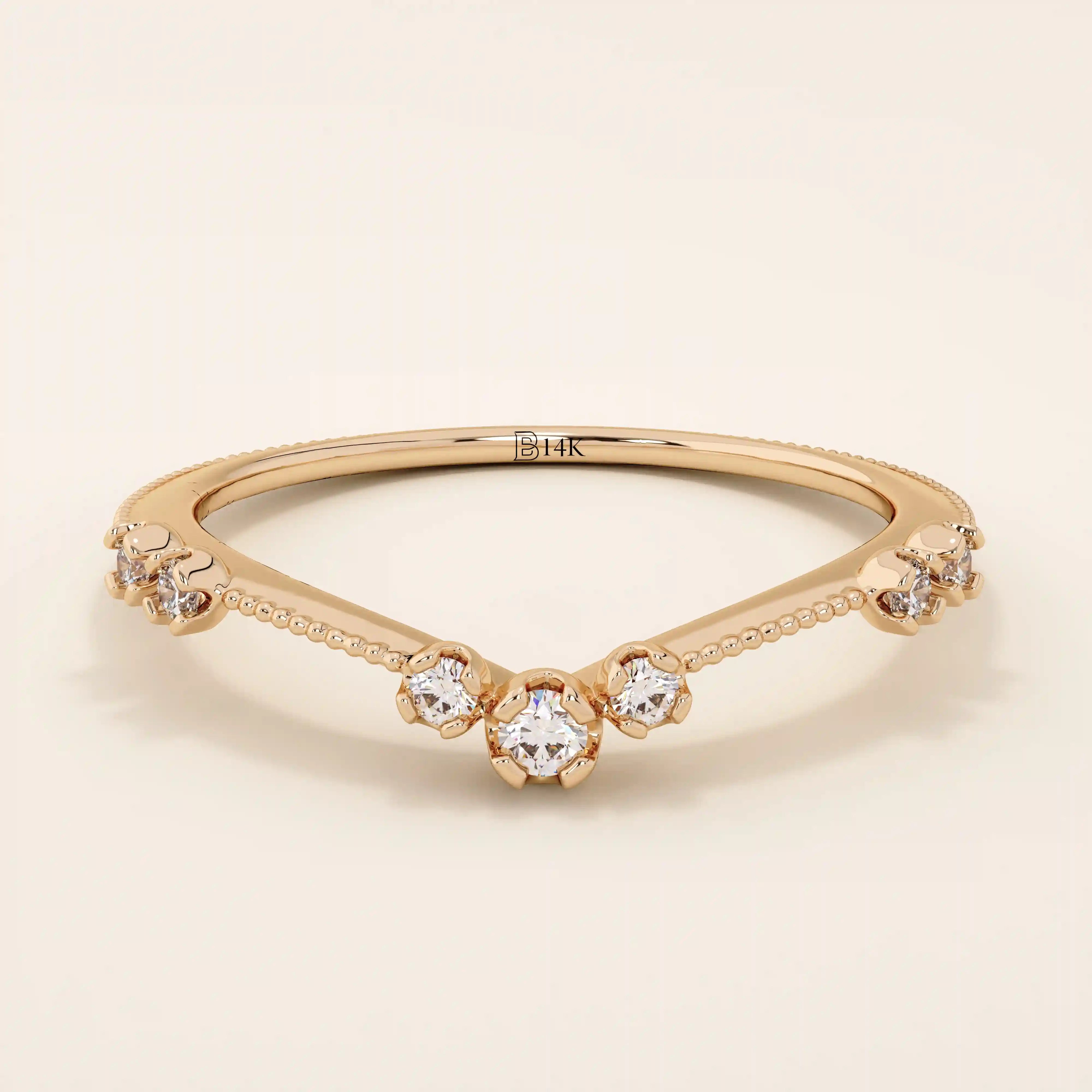 Vintage-inspired slim curved stacking ring in 14k solid gold featuring tiny moissanites set on a milgrain textured band. Elegant and detailed design perfect for layering.