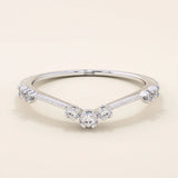 Vintage-inspired slim curved stacking ring in 14k solid gold featuring tiny moissanites set on a milgrain textured band. Elegant and detailed design perfect for layering.