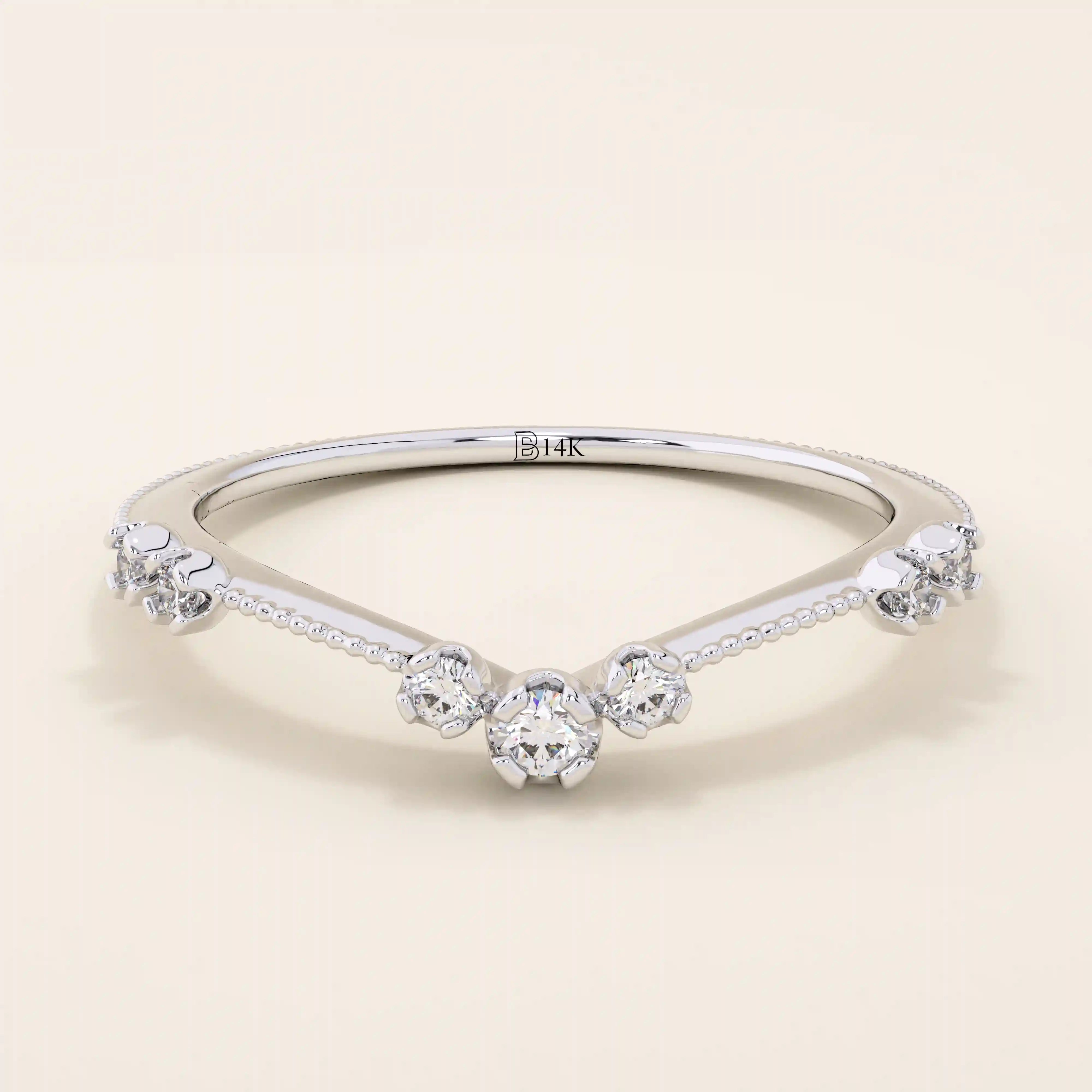 Vintage-inspired slim curved stacking ring in 14k solid gold featuring tiny moissanites set on a milgrain textured band. Elegant and detailed design perfect for layering.