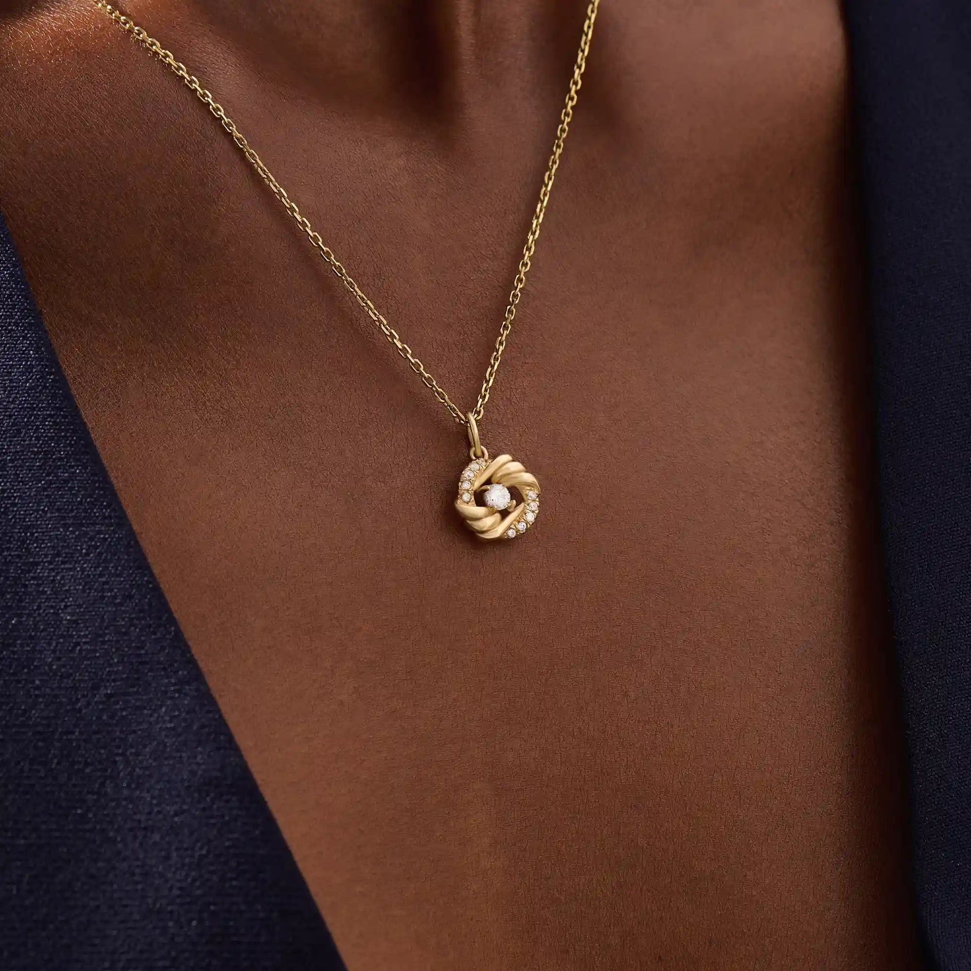 Woman wearing a 14k solid gold circle pendant necklace with sparkling pave moissanites. Unique and stylish gold jewelry piece. Perfect for everyday elegance or layering.