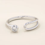 stackable statement ring features a bezel-set solitaire round stone in a 14K solid yellow gold band FOR WOMEN