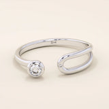stackable statement ring features a bezel-set solitaire round stone in a 14K solid yellow gold band FOR WOMEN