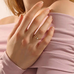 stackable statement ring features a bezel-set solitaire round stone in a 14K solid yellow gold band FOR WOMEN