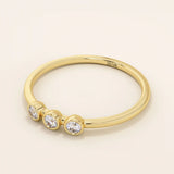 three bezel-set sparkling stones in brilliant 14k solid yellow gold slim band wedding stacking ring for women