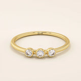 three bezel-set sparkling stones in brilliant 14k solid yellow gold slim band wedding stacking ring for women
