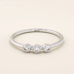 three bezel-set sparkling stones in brilliant 14k solid yellow gold slim band wedding stacking ring for women