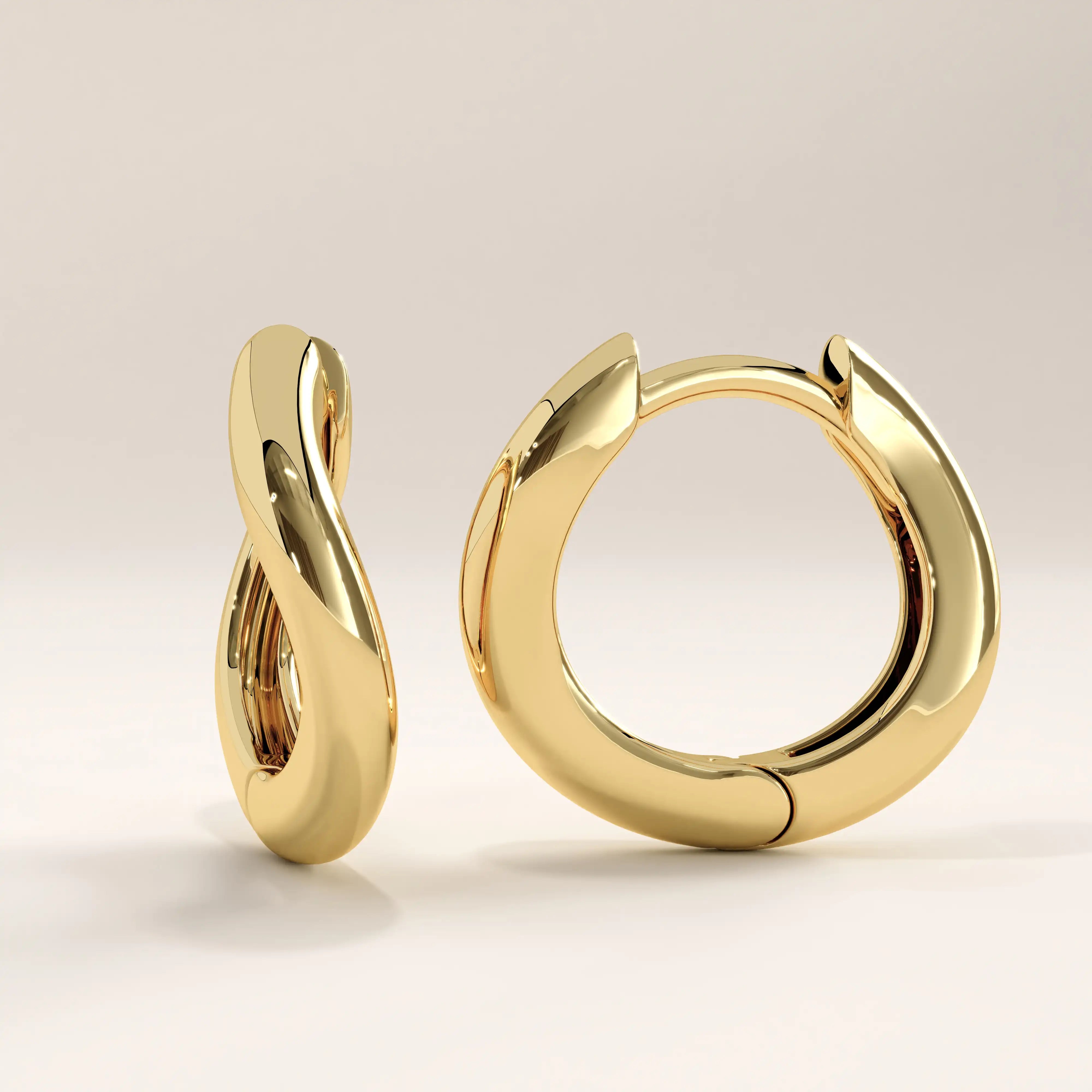 14k gold vermeil dome hoop earrings featuring a smooth, sculptural silhouette with a high-polish finish that reflects light beautifully for a modern yet timeless look.
