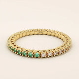 half of the ring is lab grown emerald other half clear colorless moissanite eternity stacking wedding ring in gold for women