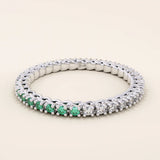 half of the ring is lab grown emerald other half clear colorless moissanite eternity stacking wedding ring in gold for women