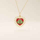14K solid gold necklace features a beautifully detailed pink and blue enamel evil eye heart pendant