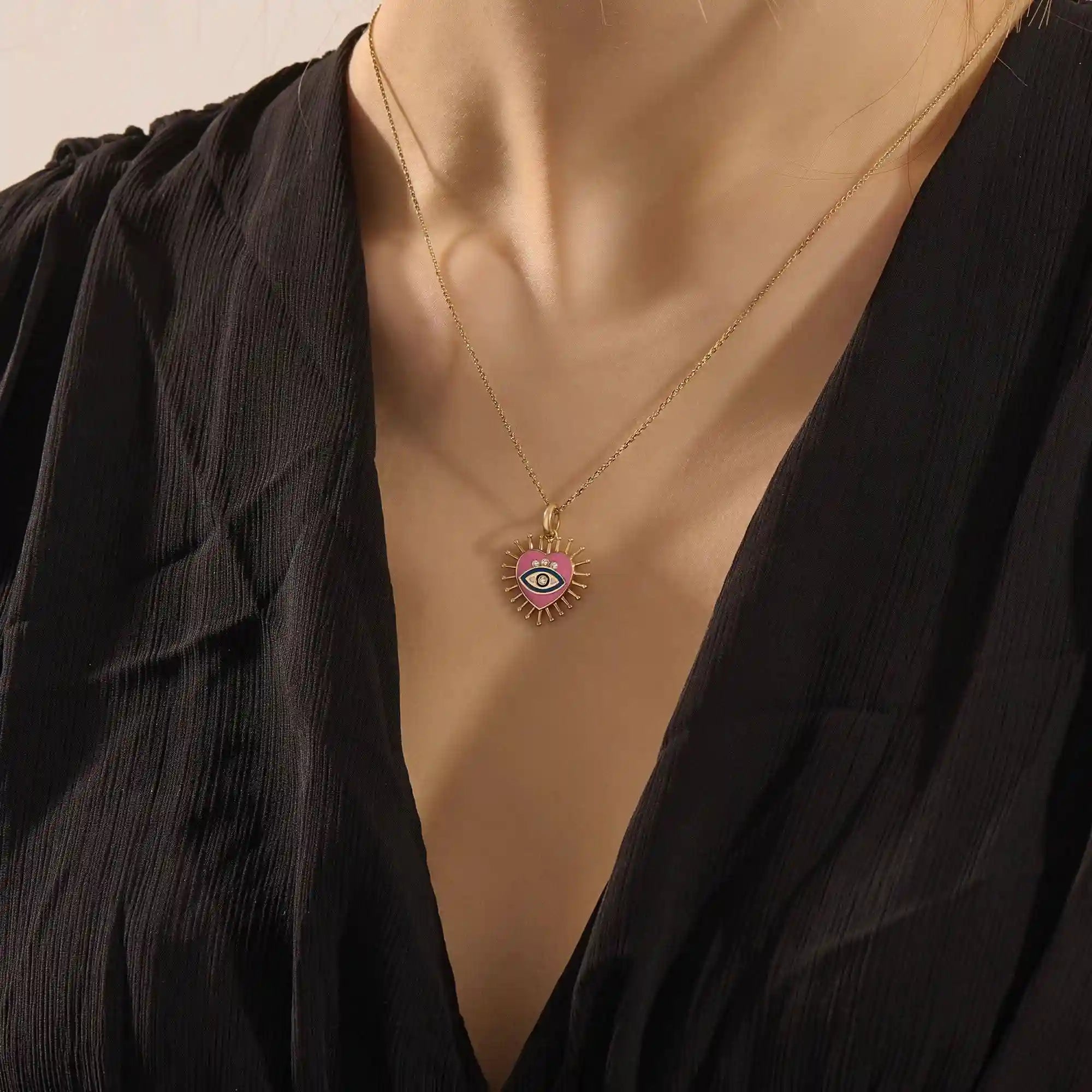 14K solid gold necklace features a beautifully detailed pink and blue enamel evil eye heart pendant
