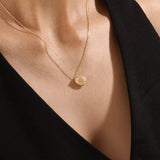 Model wearing a 14k gold vermeil 3D heart necklace featuring a sculpted heart pendant with soft curves and a delicate cubic zirconia accent for a graceful, contemporary look.
