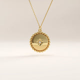 Side view of 14k gold vermeil beaded coin necklace highlighting the intricate bead-edge texture and central stone setting that enhance its elegant craftsmanship.
