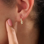 Model wearing 14k gold vermeil beaded hoop earrings showcasing the radiant beaded design and subtle shimmer, perfect for everyday elegance or evening wear.
