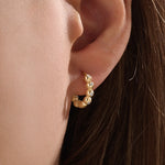 Model wearing 14k gold vermeil beaded hoop earrings showcasing the radiant beaded design and subtle shimmer, perfect for everyday elegance or evening wear.
