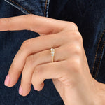 Model wearing a 14k gold vermeil beaded trio ring featuring three round cubic zirconia stones, adding a subtle sparkle to a modern everyday look.
