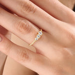 Model wearing a 14k gold vermeil beaded trio ring featuring three round cubic zirconia stones, adding a subtle sparkle to a modern everyday look.
