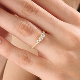 Model wearing a 14k gold vermeil beaded trio ring featuring three round cubic zirconia stones, adding a subtle sparkle to a modern everyday look.
