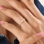 Model wearing a 14k gold vermeil beaded trio ring featuring three round cubic zirconia stones, adding a subtle sparkle to a modern everyday look.
