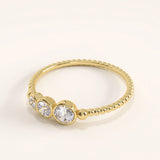 Side view of 14k gold vermeil beaded trio ring showcasing the detailed beaded band and brilliant cubic zirconia trio arrangement.
