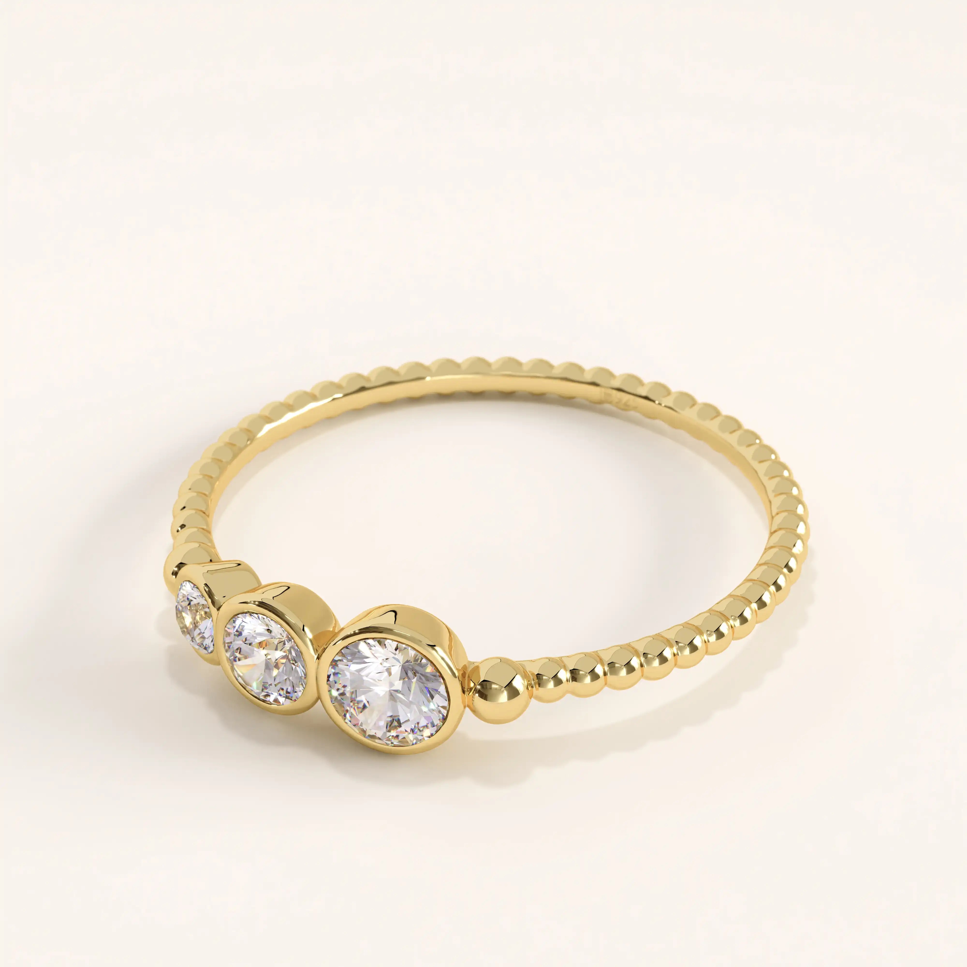 Side view of 14k gold vermeil beaded trio ring showcasing the detailed beaded band and brilliant cubic zirconia trio arrangement.
