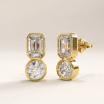 Side view of 14k gold vermeil toi et moi stud earrings highlighting the double-stone composition and polished bezel settings that reflect light with refined brilliance.
