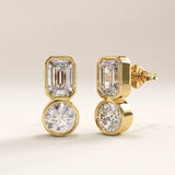 Side view of 14k gold vermeil toi et moi stud earrings highlighting the double-stone composition and polished bezel settings that reflect light with refined brilliance.
