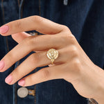 Model wearing a 14k gold vermeil boho sun ring adorned with cubic zirconia accents, highlighting its radiant celestial design and warm golden glow.

