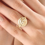 Model wearing a 14k gold vermeil boho sun ring adorned with cubic zirconia accents, highlighting its radiant celestial design and warm golden glow.
