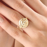 Model wearing a 14k gold vermeil boho sun ring adorned with cubic zirconia accents, highlighting its radiant celestial design and warm golden glow.
