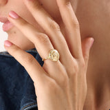 Model wearing a 14k gold vermeil boho sun ring adorned with cubic zirconia accents, highlighting its radiant celestial design and warm golden glow.
