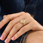 Model wearing a 14k gold vermeil boho sun ring adorned with cubic zirconia accents, highlighting its radiant celestial design and warm golden glow.
