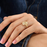 Model wearing a 14k gold vermeil boho sun ring adorned with cubic zirconia accents, highlighting its radiant celestial design and warm golden glow.
