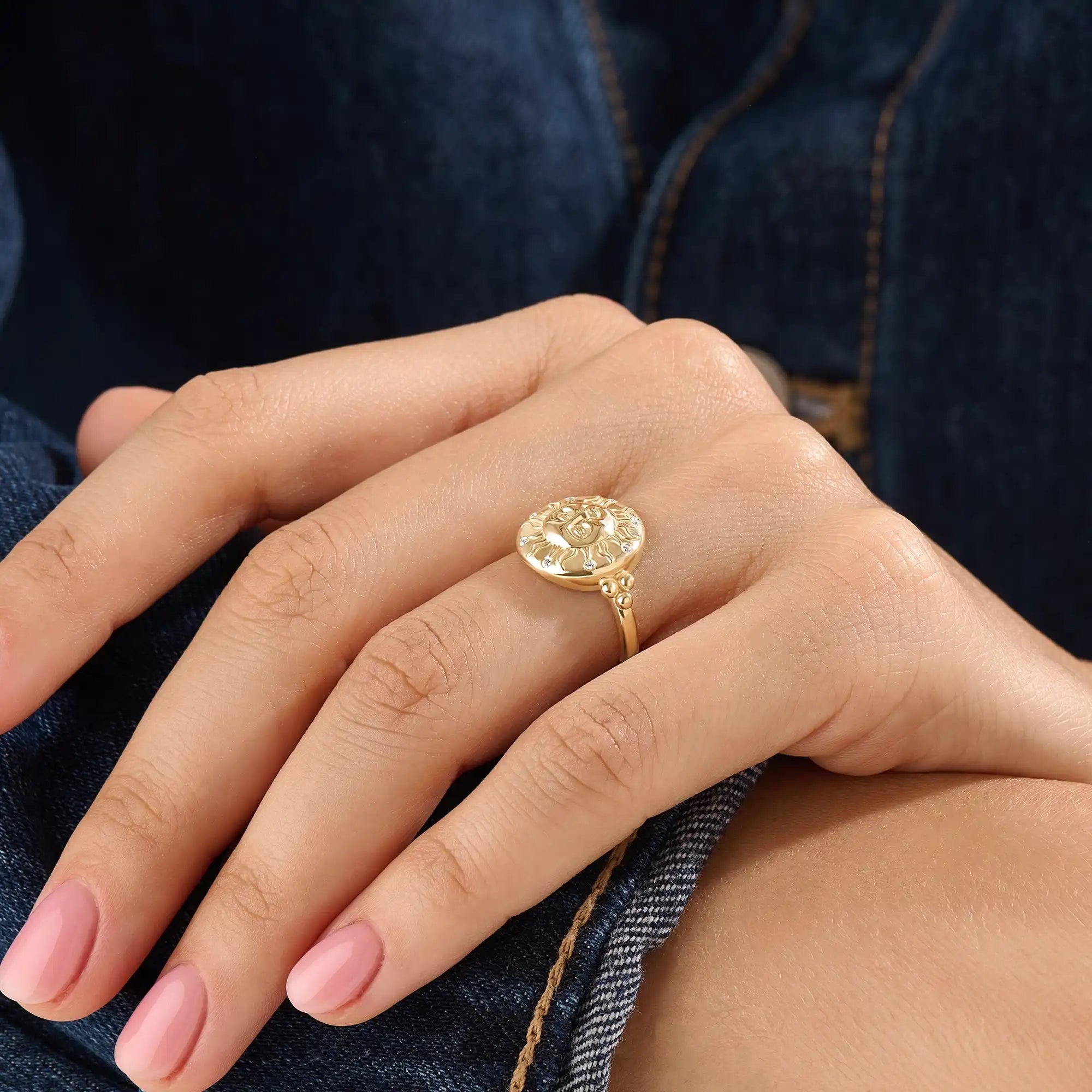 Model wearing a 14k gold vermeil boho sun ring adorned with cubic zirconia accents, highlighting its radiant celestial design and warm golden glow.
