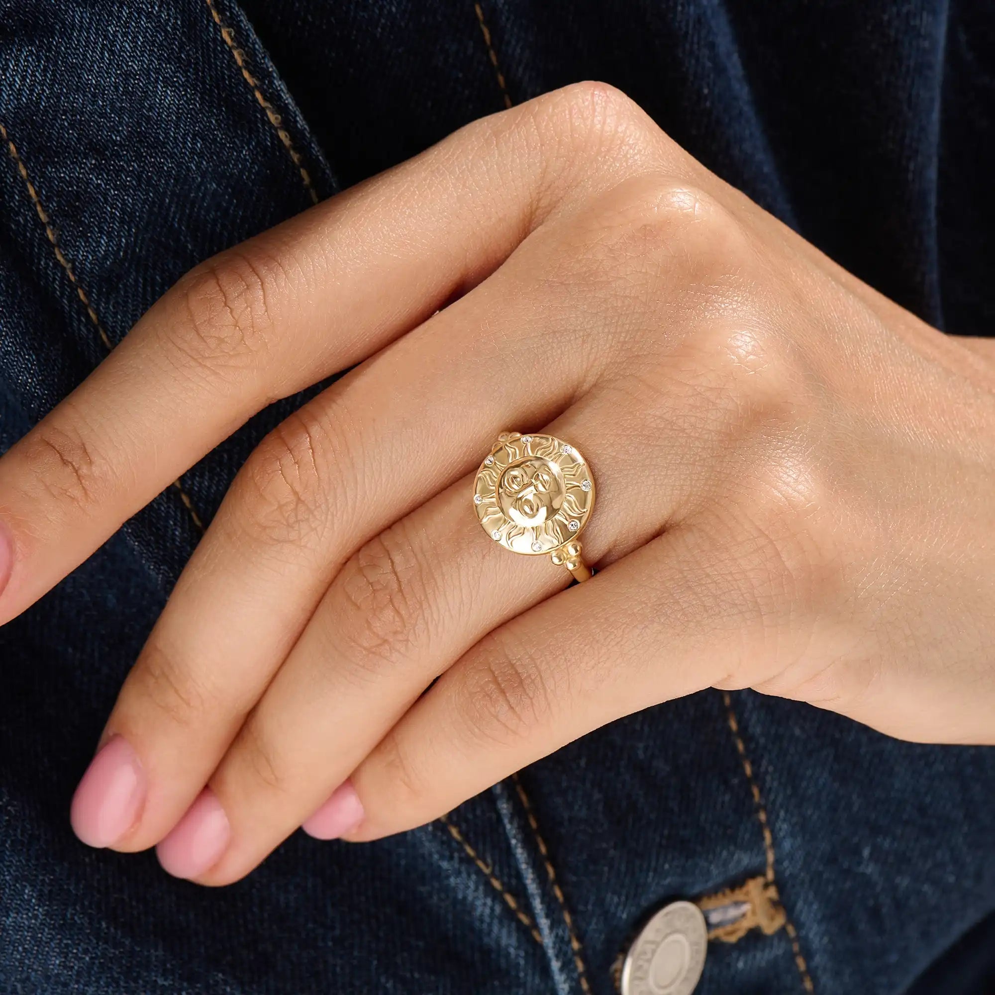 Model wearing a 14k gold vermeil boho sun ring adorned with cubic zirconia accents, highlighting its radiant celestial design and warm golden glow.
