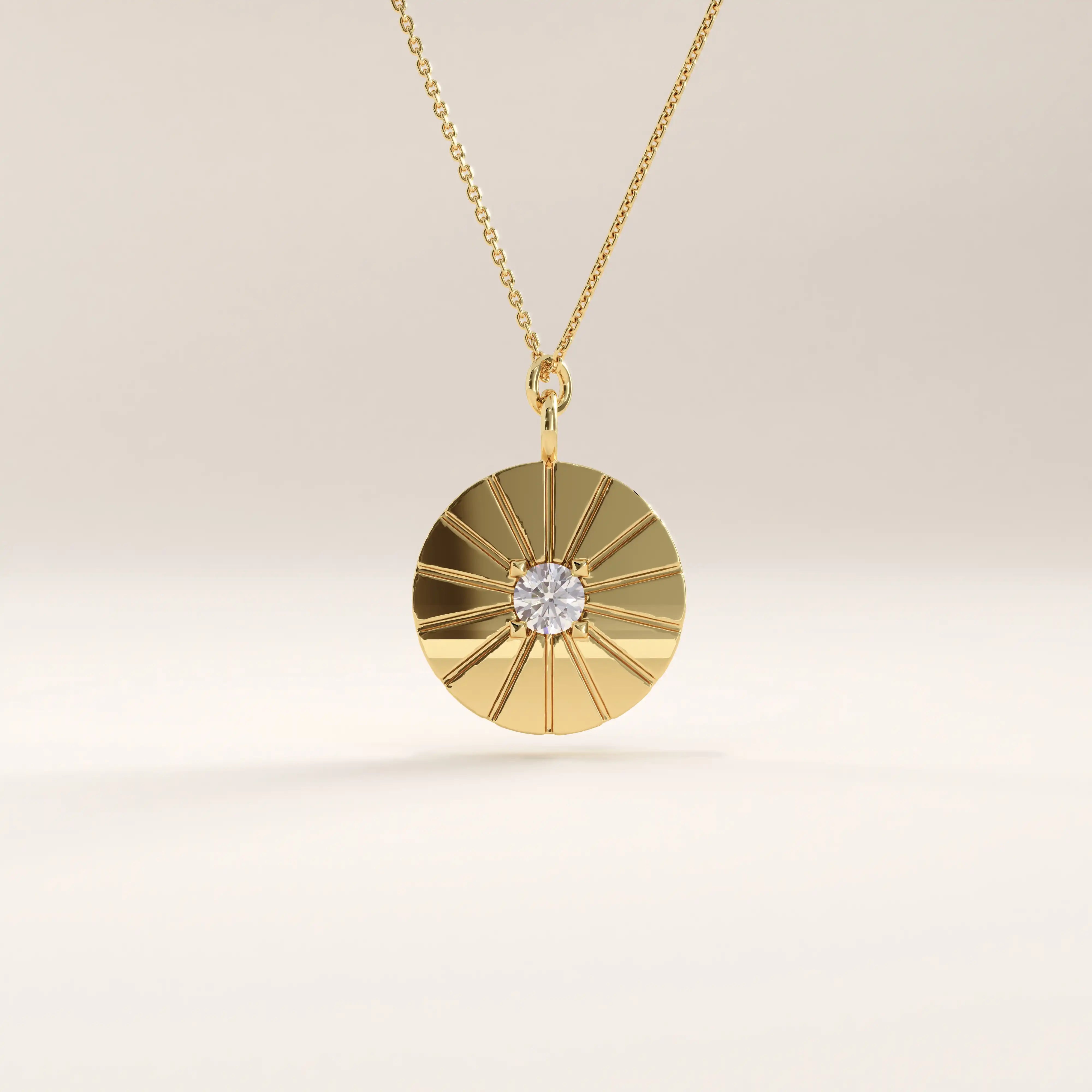 Side view of 14k gold vermeil coin necklace highlighting the raised sunburst pattern and bezel-set cubic zirconia at the center of the pendant.
