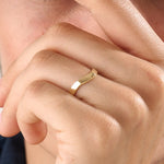 Model wearing a 14k gold vermeil curve band ring with a softly curved design, showcasing a timeless minimalist style for women.

